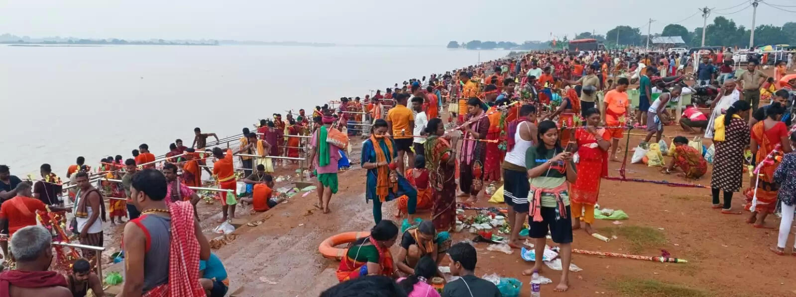 Kawariyas Flock to Mahanadi Riverbank for Shravan Month Celebrations