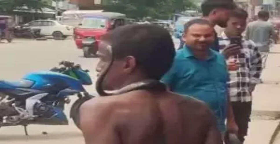 What’s the Buzz? Man Strolls Shirtless with a Snake in Viral Video!