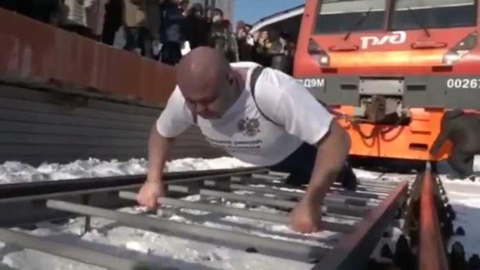 Russian man shocks everyone by pulling 218-tonne train to impress his fiancee