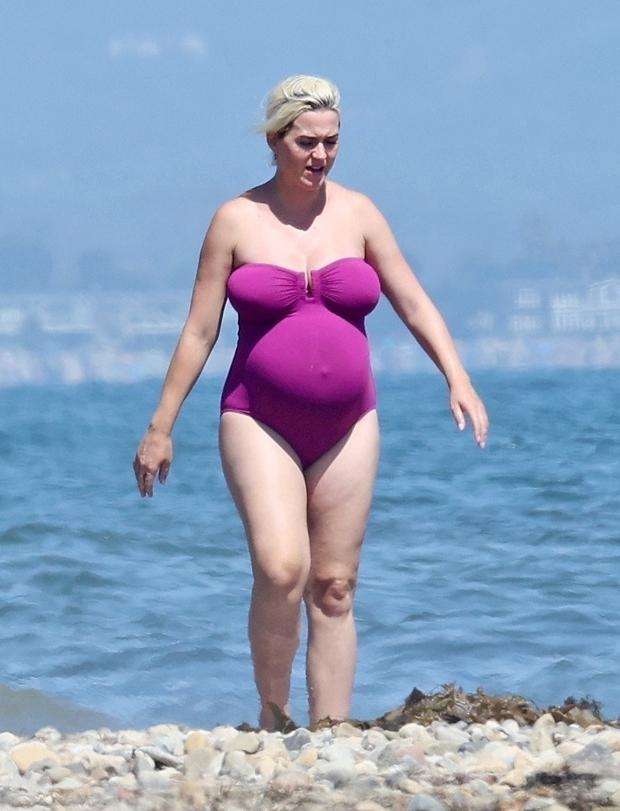 Katy Perry Looks Ready To Pop WhileShowing Off Her Baby Bump In StraplessSwimsuit On The Beach