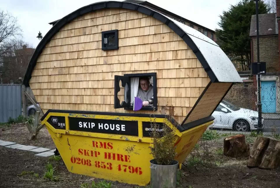 Dumpster Digs: UK Artist Turns Discarded Bin into Charming Tiny Home with Impressive Creativity