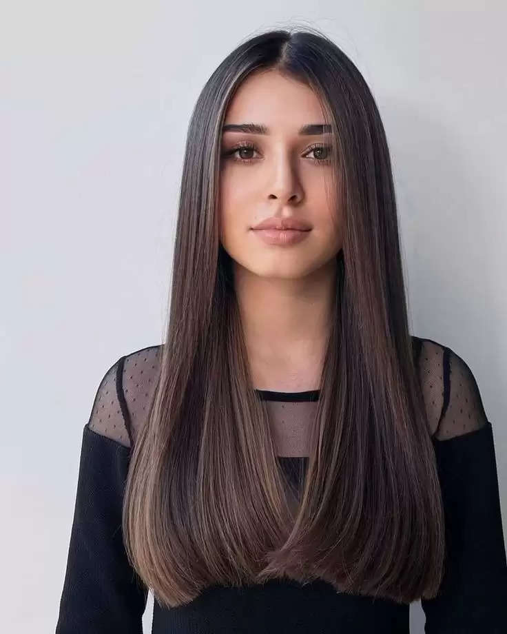 2. Shiny straight hair with a middle part